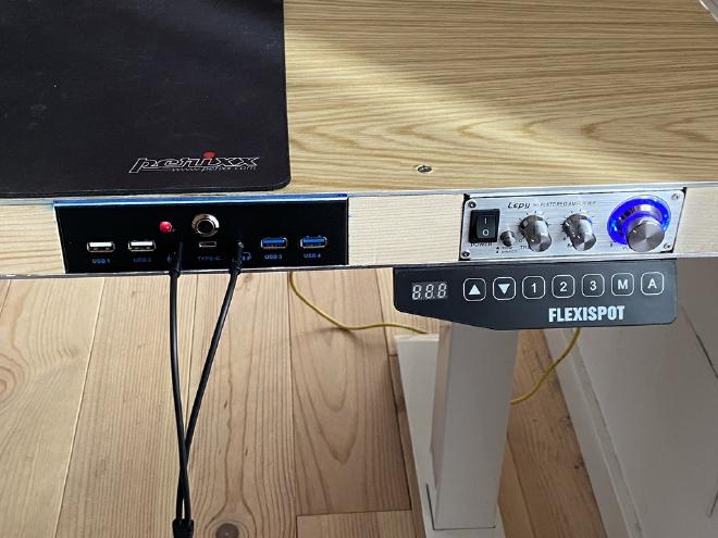 Close up of the side controls: USB and headphone to the left, audio to the right, height under the audio